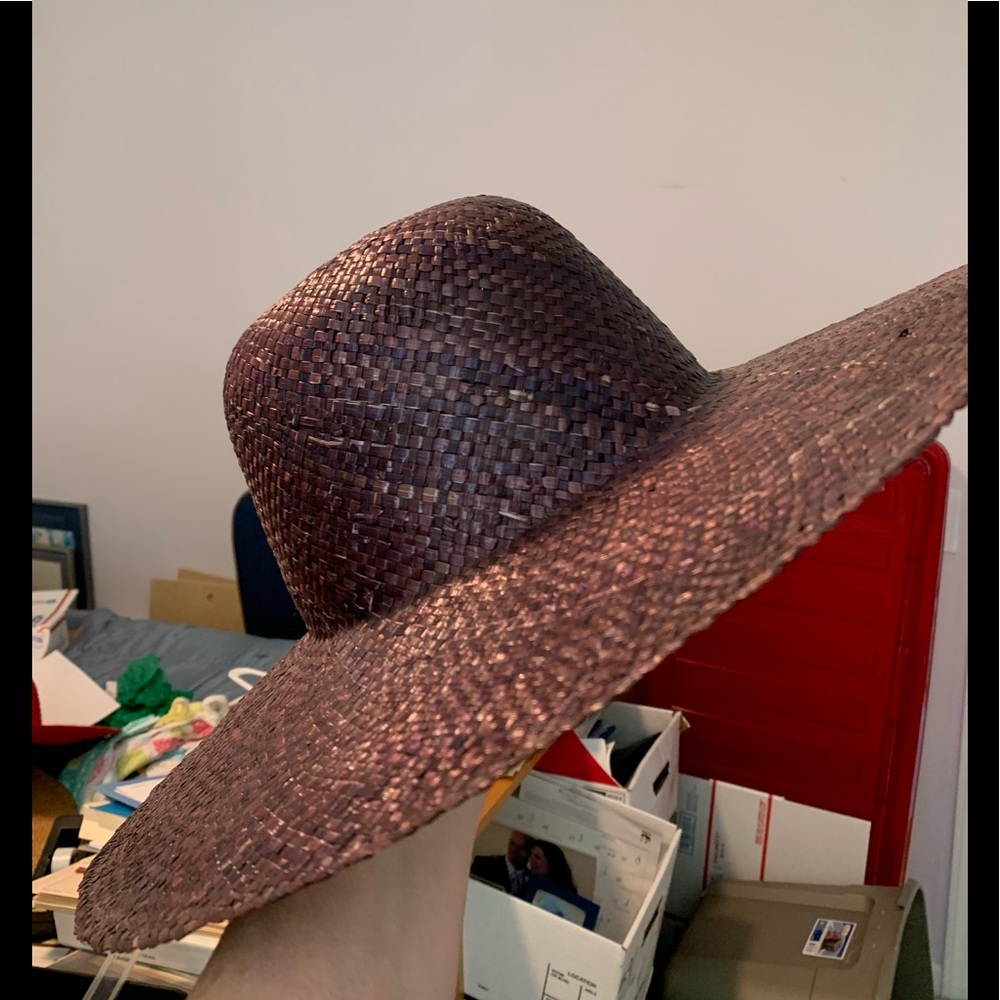 Lightweight purple straw hat, wide brim.